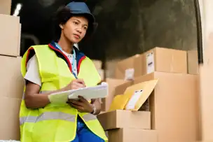 Business team reviewing international trade and shipping documentation
