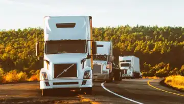 Freight truck driving on Kenyan road for land distribution