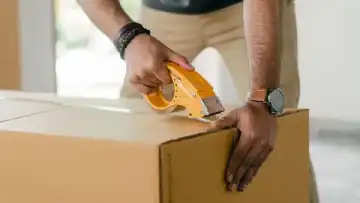 Courier carrying parcel for urgent same-day delivery in Nairobi
